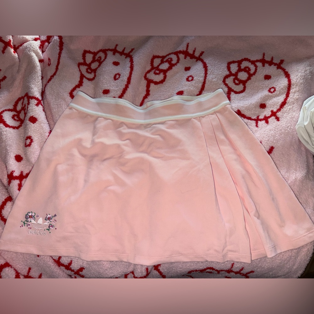 Adidas Light Pink “PLEATED SKIRT WITH FLORAL FLAIR AND SPORTY STYLE.”